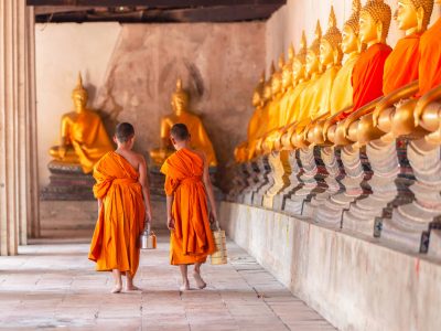 Two novices walking return and talking in old temple at Ayutthaya Province, Thailand